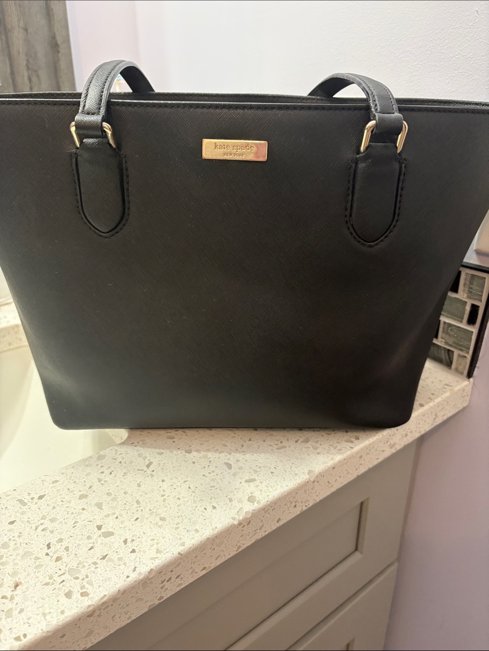 kate spade black saffiano tote with gold plaque